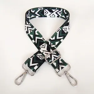 Close-up of ethnic style wide adjustable shoulder strap with B58 geometric pattern and silver hooks