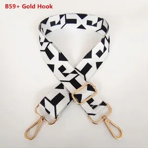 Detail of Style B59 adjustable bag strap with black and white geometric pattern and gold hooks