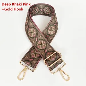 Detail of bohemian khaki and pink woven shoulder strap with gold metal lobster clasps