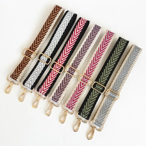 Adjustable woven canvas shoulder strap with chevron pattern and gold metal lobster clasps