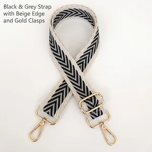 Adjustable canvas shoulder strap with black and gray herringbone pattern and gold hooks