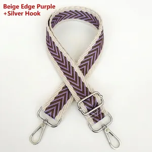 Detail of adjustable purple and brown chevron canvas strap with silver metal swivel hooks