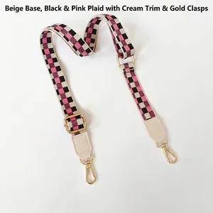 Bandoulière tissée réglable avec motif à carreaux noir et rose et mousquetons dorés