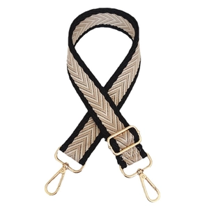 Adjustable wide canvas bag strap with beige and black chevron pattern and gold metal hooks