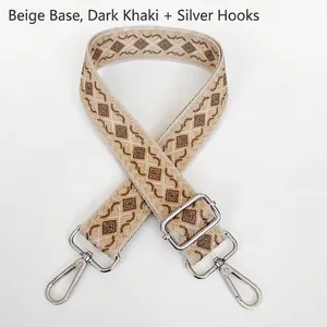 Close-up of geometric diamond pattern on thick canvas bag strap with silver metal buckles
