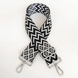 Detail of black and white chevron bag strap with durable silver metal rotating hooks
