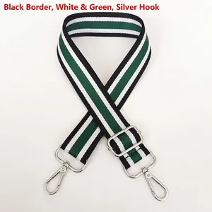Detail of adjustable black, white, and green striped woven strap with silver metal hooks