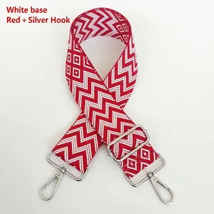 Detail of red and white zigzag woven strap with silver swivel metal hooks