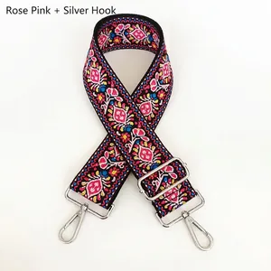 Detailed embroidery texture on rose pink ethnic style adjustable wide bag strap with silver hooks