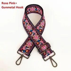 Detail of rose pink ethnic embroidery bag strap with durable gunmetal metal hooks