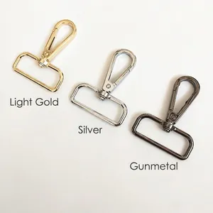 Close-up of swivel lobster clasps in light gold, silver, and gunmetal for bag straps