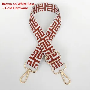Adjustable jacquard bag strap with brown geometric pattern and gold swivel snap hooks