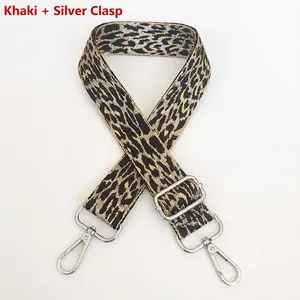 Close-up of khaki leopard print bag strap with silver metal hooks and adjustable buckle