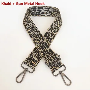 Detail of adjustable khaki leopard print bag strap with gunmetal lobster hooks