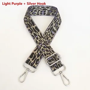 Detail of adjustable leopard print bag strap in light purple with silver swivel hooks