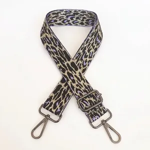 Detail of adjustable leopard print bag strap in light purple with gunmetal metal hooks