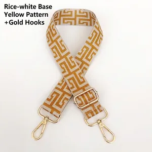 Adjustable wide canvas shoulder strap with yellow geometric jacquard and gold metal hooks