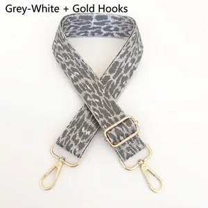Detail of adjustable leopard print bag strap with high-quality gold metal lobster clasps