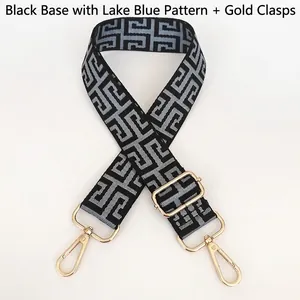 Detail of adjustable black and lake blue jacquard bag strap with gold metal hooks