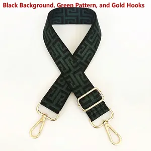 Detail view of ethnic canvas bag strap in black and green with gold swivel metal hooks