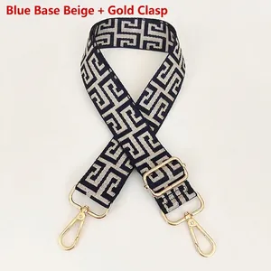 Detail of adjustable geometric jacquard bag strap with gold metal lobster clasps
