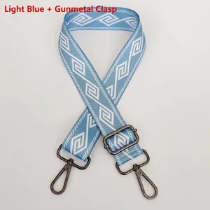 Adjustable wide nylon strap in light blue with geometric diamond pattern and gunmetal hooks