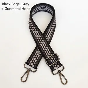 Close-up of durable gray jacquard replacement bag strap with gunmetal swivel hooks
