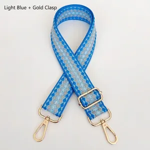 Adjustable light blue geometric pattern wide shoulder strap with gold metal hooks