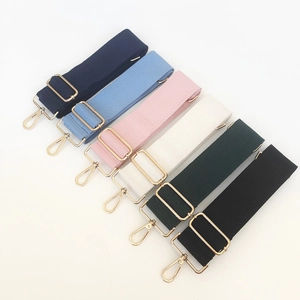 Detail of adjustable canvas bag straps in six colors with gold metal hooks and hardware