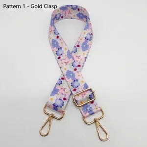 Bandoulière à fleurs rose et violet avec des crochets pivotants en métal doré brillant
