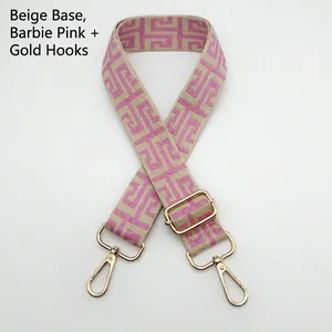 Detail of colorful geometric canvas strap with golden swivel hooks and slide adjuster