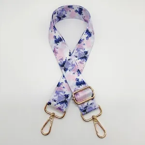 Bandoulière réglable avec motif tie-dye violet et bleu, sangle florale et crochets dorés