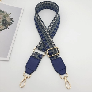 Adjustable wide woven shoulder strap with blue geometric jacquard and gold hardware
