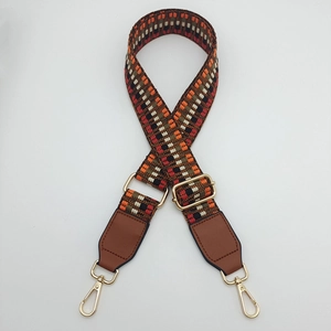 Adjustable retro ethnic geometric woven bag strap with golden metal hooks and brown leather ends