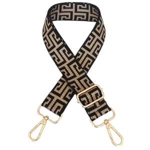 Detail of adjustable geometric weave bag strap with golden metal lobster clasps