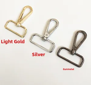 Detailed view of metal swivel lobster clasps in gold, silver, and gunmetal finishes
