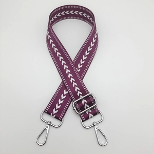 Detail of purple nylon strap with white chevron pattern and silver swivel metal clasps
