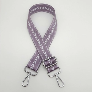 Adjustable purple nylon strap with white arrow pattern and silver metal hooks