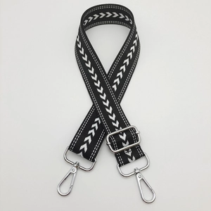 Adjustable nylon shoulder strap with black and white arrow pattern and silver metal hooks