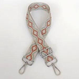 Wide adjustable woven bag strap with geometric patterns and silver metal hooks