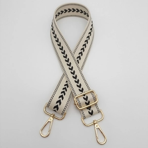 Adjustable nylon shoulder strap with black chevron pattern and gold metal hardware