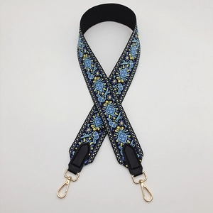 Ethnic wide shoulder strap with blue and yellow embroidery and gold metal hardware