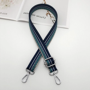 Adjustable striped canvas shoulder strap with silver lobster clasps for handbags