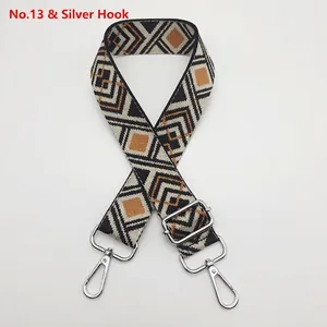 Detail of bohemian geometric woven strap with silver swivel hooks and adjustable buckle