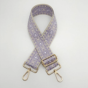 Detail of adjustable wide nylon shoulder strap with purple and white diamond embroidery