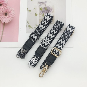 Adjustable 2.5cm black and white embroidered canvas strap with geometric ethnic patterns