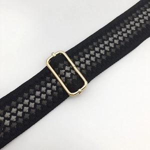Detail of 5cm wide thickened woven bag strap with golden metal adjustment buckle