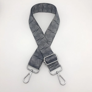 Close-up of adjustable nylon strap with black and white geometric spiral pattern