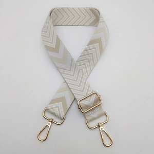 Detail of adjustable chevron weave shoulder strap with gold-tone lobster clasps