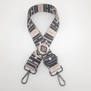 Detail of ethnic geometric wide bag strap with gunmetal lobster clasps and adjuster